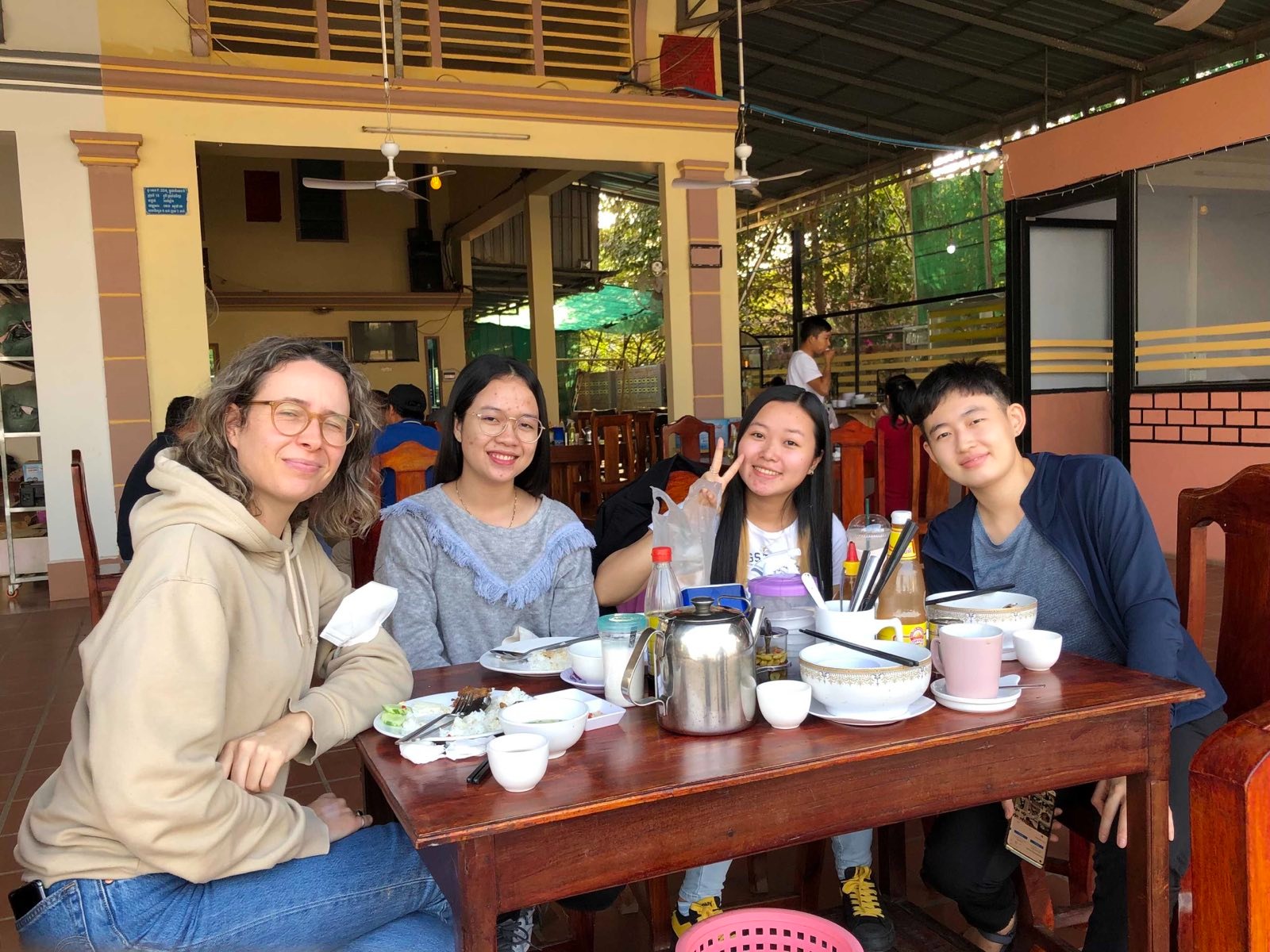 OPCC mentor Marta Kasztelan, Newsroom trainees Som Sreypich and Klaing Kimhouy, and OPCC mentor Cindy Liu (from left) take a lunch break during a reporting trip in January 2021.